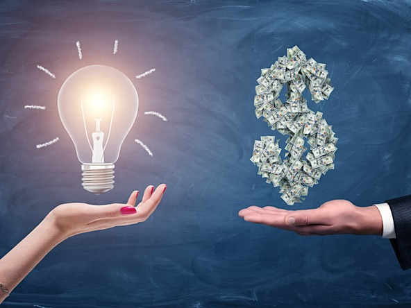 A woman holding a lightbulb and a man holding a dollar sign made out of bills, representing the concept of investment in a bright idea.